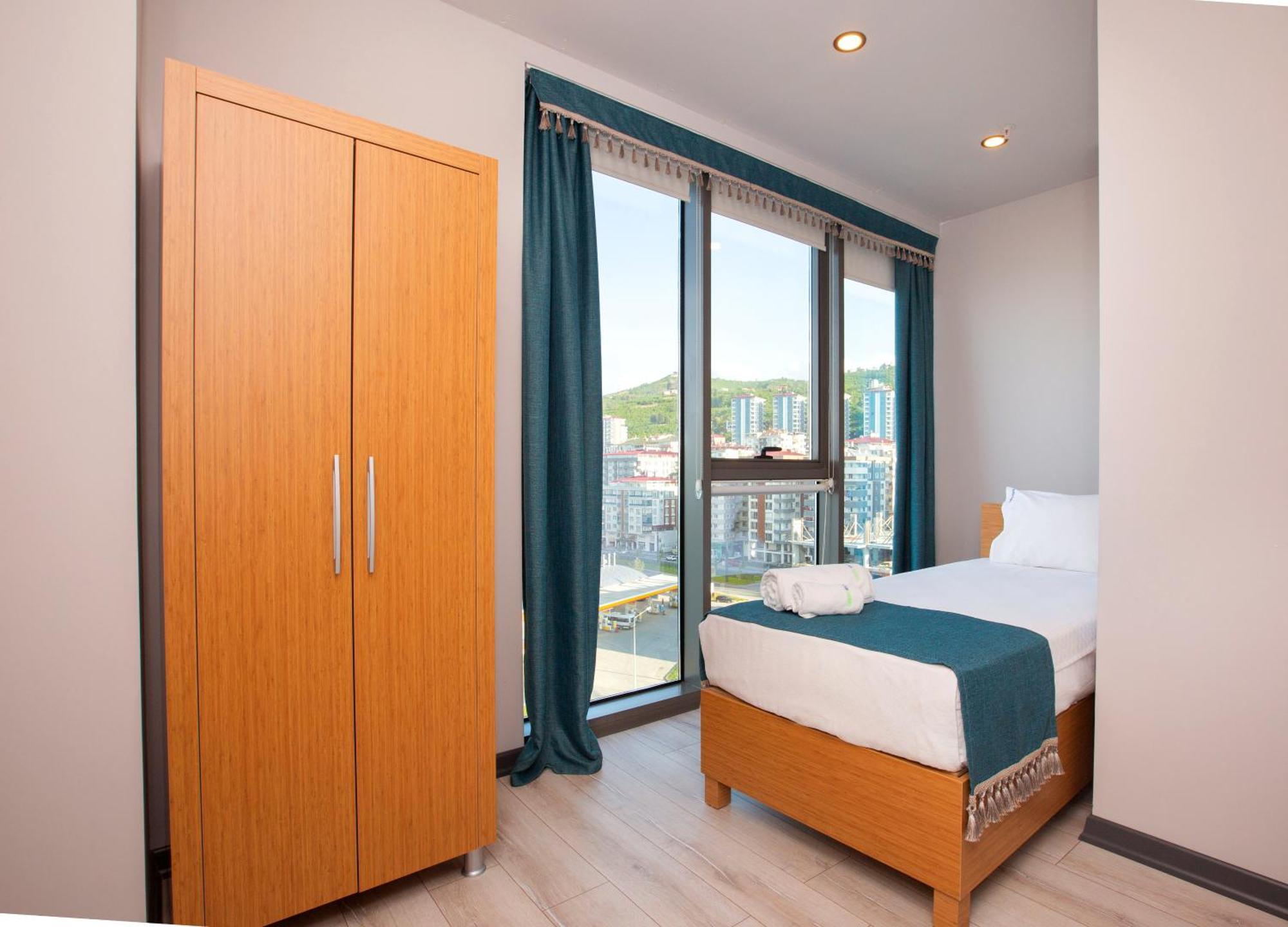 Marina Green Suite & Residence Trebizonda Quarto foto